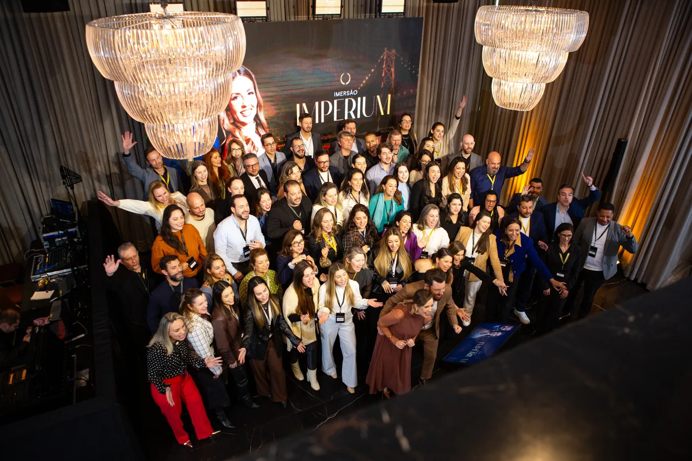 Participantes da Imersão Imperium 2026 reunidos diante do palco